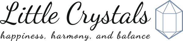 Little Crystals logo heading features the words little crystals along with an image of a crystal. 