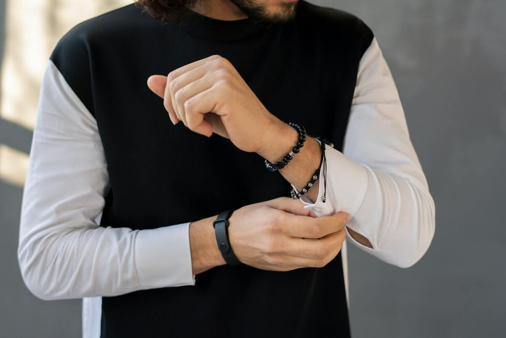 Man wearing a crystal healing bracelet.