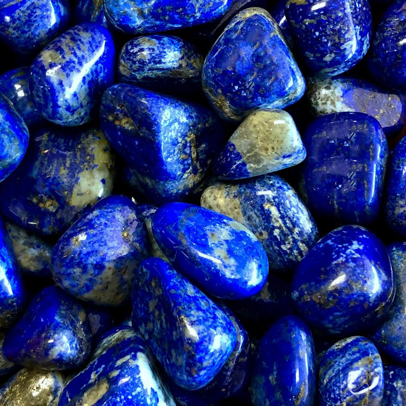 Polished Lapis Lazuli gemstones. Lapis Lazuli is believed to have many magical properties.