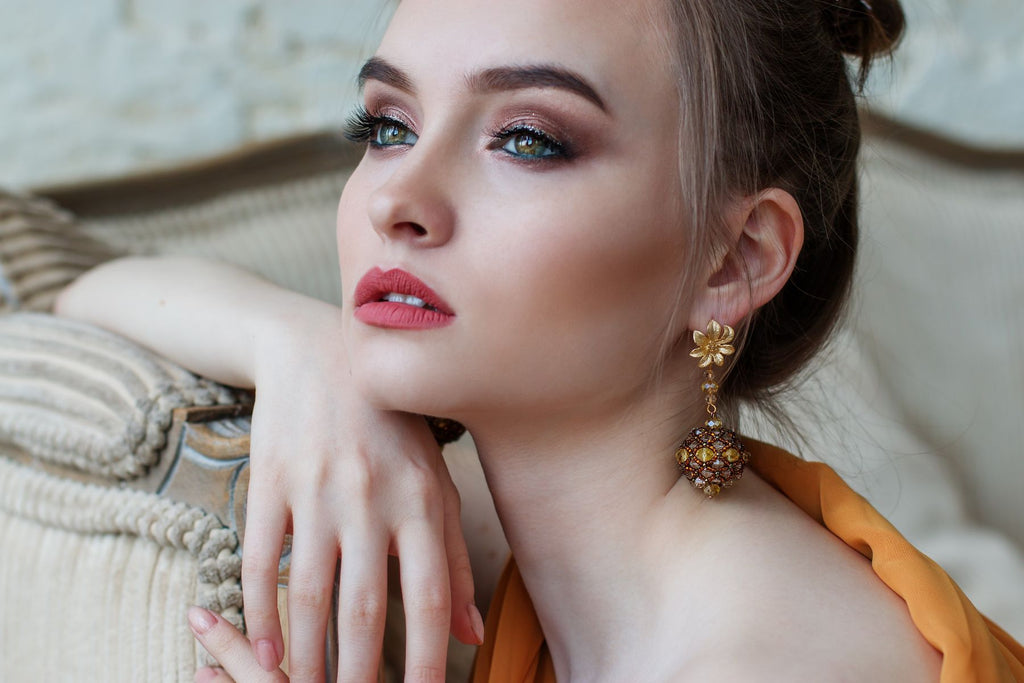 Model wears crystal earrings