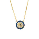 A close up of the evil eye gold necklace against a white background. The gemstones are visible