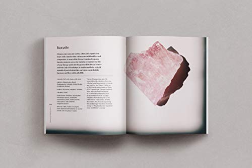 The book Crystal Healing for Women is opened to one of the pages. that displays text and a picture of a crystal.