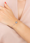 Model is pictured wearing the evil eye bracelet with silver finish