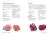 The book Crystals for Beginners has been opened to display the Rhodochrosite and Ruby crystal stones. The accompanying text describing the stones is also visible.