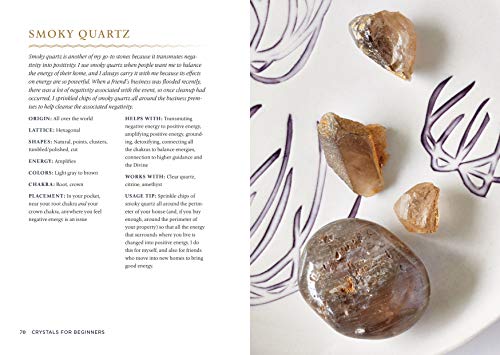 The book Crystals for Beginners has been opened to smoky quartz crystals. A picture of the crystal is visible along with the accompanying text.