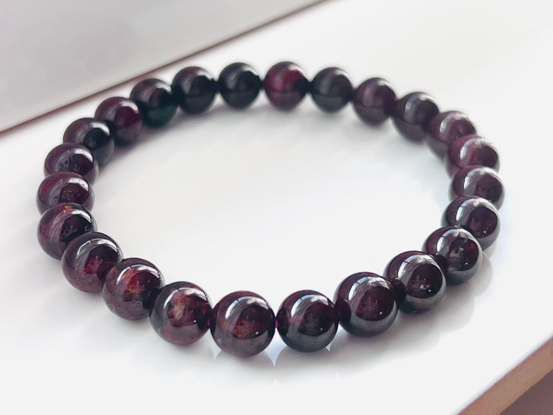 A close up of the beads on this 8mm Garnet Gemstone Bracelet