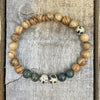 A close up the beads on the Dalmatian, Serpentine, & Sandalwood bracelet