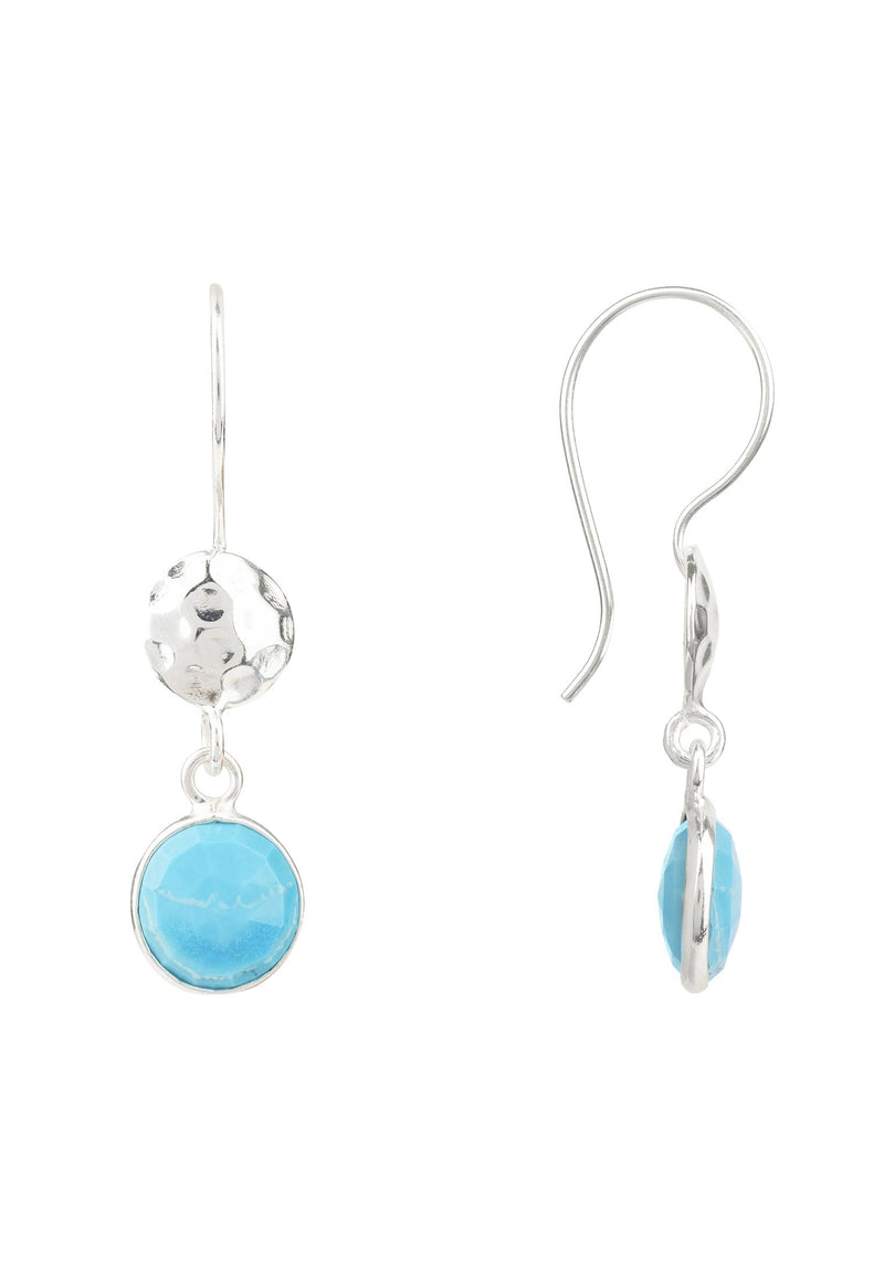 A side view of the circle and hammer turquoise earrings